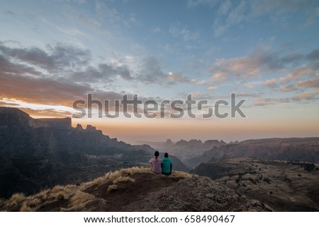 Two explorers enjoying the sunset after a day of difficult hiking, Simien Mountains, Ethiopia Stock photo © 