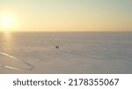 The two explorers going trough the snow field