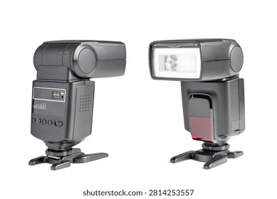 Two external camera flash speedlights isolated on a clean white background. Front and side view of professional photographic electronic flash units with stands.