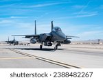 Two F-15E Strike Eagles taxi down the flight line for a joint training operation with the Royal Australian Air Force (RAAF) at Nellis Air Force Base, Nevada, Nov. 2, 2023. 
