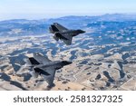 Two F-35C Lightning IIs, from Strike Fighter Squadron (VFA) 147, stationed at Naval Air Station Lemoore, fly in formation for a U.S. exercise on November 16, 2018.