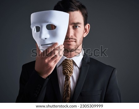 Two faced portrait, mask and fake businessman in a studio with serious face with secret personality. Manager and corporate male with rope tie showing corporate slavery and control in business suit