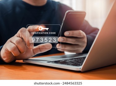 Two factor authentication or 2FA concept. Verification code with key icon press by man hand while using smart phone and laptop computer for validate password, secure steps, cyber security technology. - Powered by Shutterstock