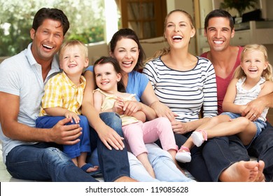 Two Families Sitting Outside House