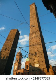 Two famous falling Bologna towers Asinelli and Garisenda. Sunset . Bologna, Emilia-Romagna, Italy.