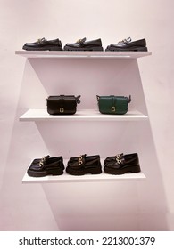 Two Fashion Women Handbag With Shoes Display On Shelf