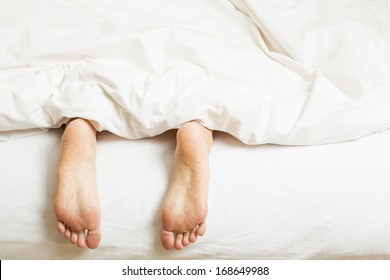 Two Feet In A Bed