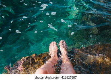 Two Feet Dipping  In Water.Foot Spa