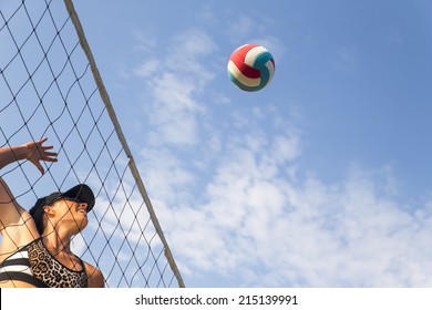 Two Female Athletes Playing Beach Volleyball