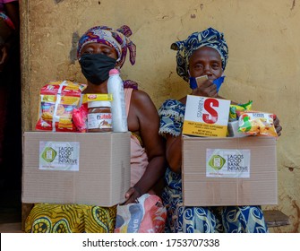 Two Female Beneficiaries Of The Lagos Food Bank Initiative Outreach To Ikotun, Lagos, Nigeria, June 7, 2020.