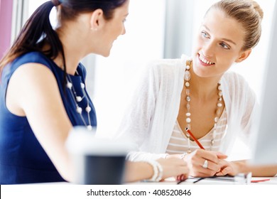 Two female colleagues in office - Shutterstock ID 408520846