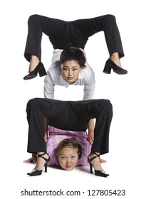 Two Female Contortionist Businesswomen