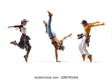 Two female dancers and one male dancer performing a hand stand isolated on white background