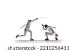 Two female fencing athletes fight isolated on white