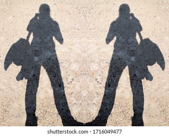 Two female figures. Shadow on a concrete background. - Powered by Shutterstock