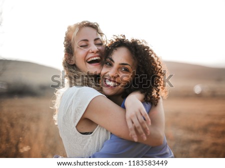 Two female friends having fun in summer.