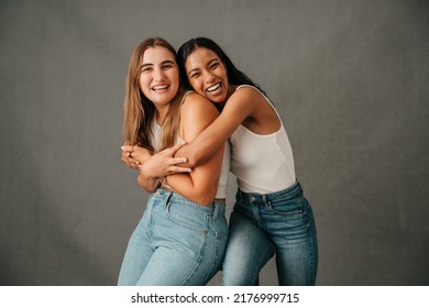 Two Female Friends Hugging And Laughing And Just Having Fun