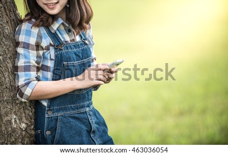 Two female hands are holding a smart phone