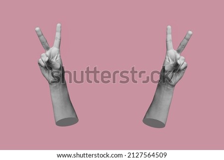 Two female hands showing a peace gesture isolated on a rosy pink color background. Trendy abstact collage in magazine urban style. 3d contemporary art. Modern design. Victory hand sign
