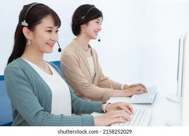 Two female operators wearing income