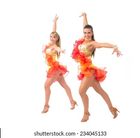 Two Female Salsa Dancers In Colorful Dresses Over White Background