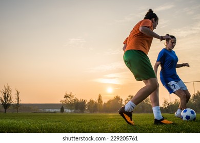 two female soccer players on the field - Powered by Shutterstock