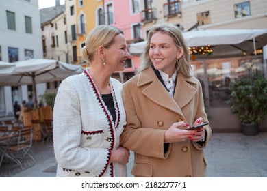 Two Female Tourists Sightseeing In The City Center