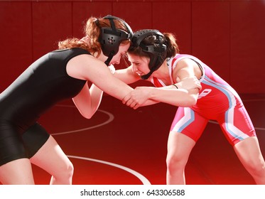 Two female wrestlers practicing