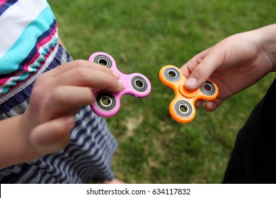 Two fidget spinners