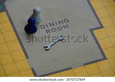 Two figures with a murder weapon in a classic guess who board game