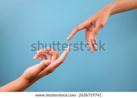 Two Fingers Almost Touching Isolated On Blue Background