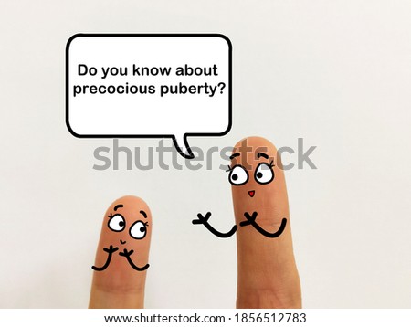 Two fingers are decorated as an adult and an adolescence.A mother is asking her child if she knows about precocious puberty.