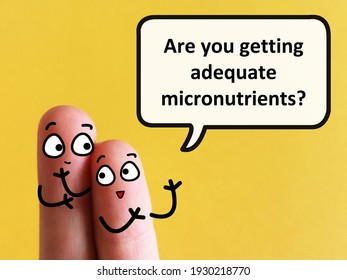 Two fingers are decorated as two person. One of them is asking  another if he is getting adequate micronutrients