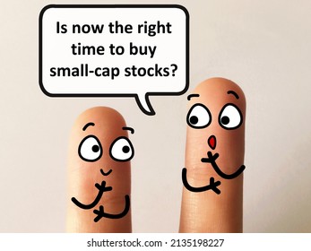 Two Fingers Are Decorated As Two Person. They Are Discussing If It Is The Right Time To Buy Small Cap Stocks.