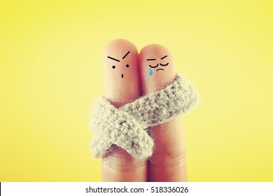 Two Fingers Decorated As Sad And Angry  Couple. 