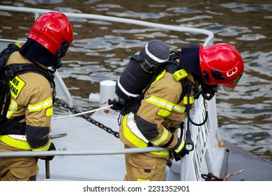 two firefighters during exercise on the water