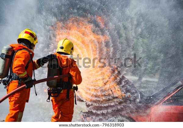 Two Firefighters Water Spray By High Stock Photo (Edit Now) 796318903