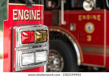 Two firetrucks lined up at fire station