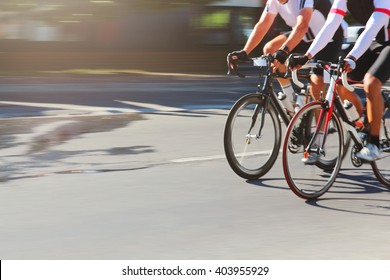 Two Fit Cyclists Race Against Each Other On The Road