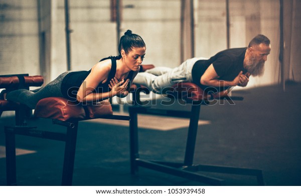 Two Fit People Focused On Doing Stock Photo Edit Now 1053939458