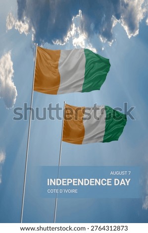 Two flags of Cote dIvoire in beautiful blue sky with clouds for National holiday of Independence