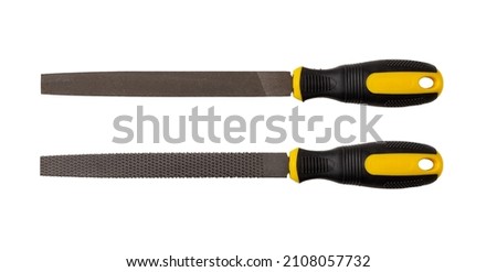 Two flat steel files with rubber handles isolated on white background. Double-cut flat file for processing of metals. Rasp for coarsely shaping wood and other material. Hand work tool. Top view.