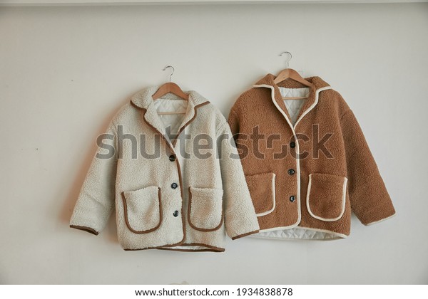 two fleece jackets on the\
hanger