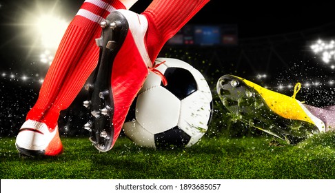 Two football player man in action on dark arena background. Soccer player making sliding tackle - Powered by Shutterstock