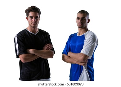 Two football players standing with arms crossed against white background - Powered by Shutterstock