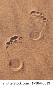 Two Footprints Barefoot In The Desert Sand