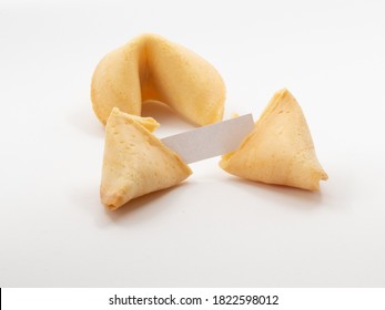 Two Fortune Cookies With One Opened And A Small Blank Piece Of Pager Visible In Front Of White Background