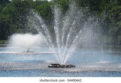  Two Fountains In Pond