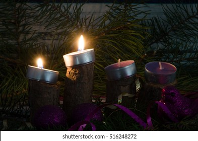two from four advent candles burning
