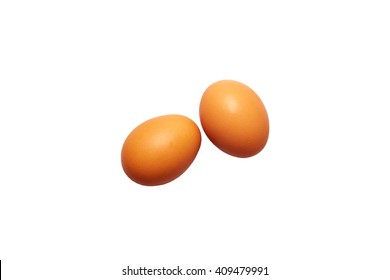 Two Fresh Eggs On A White Background. Orange Color. Top View